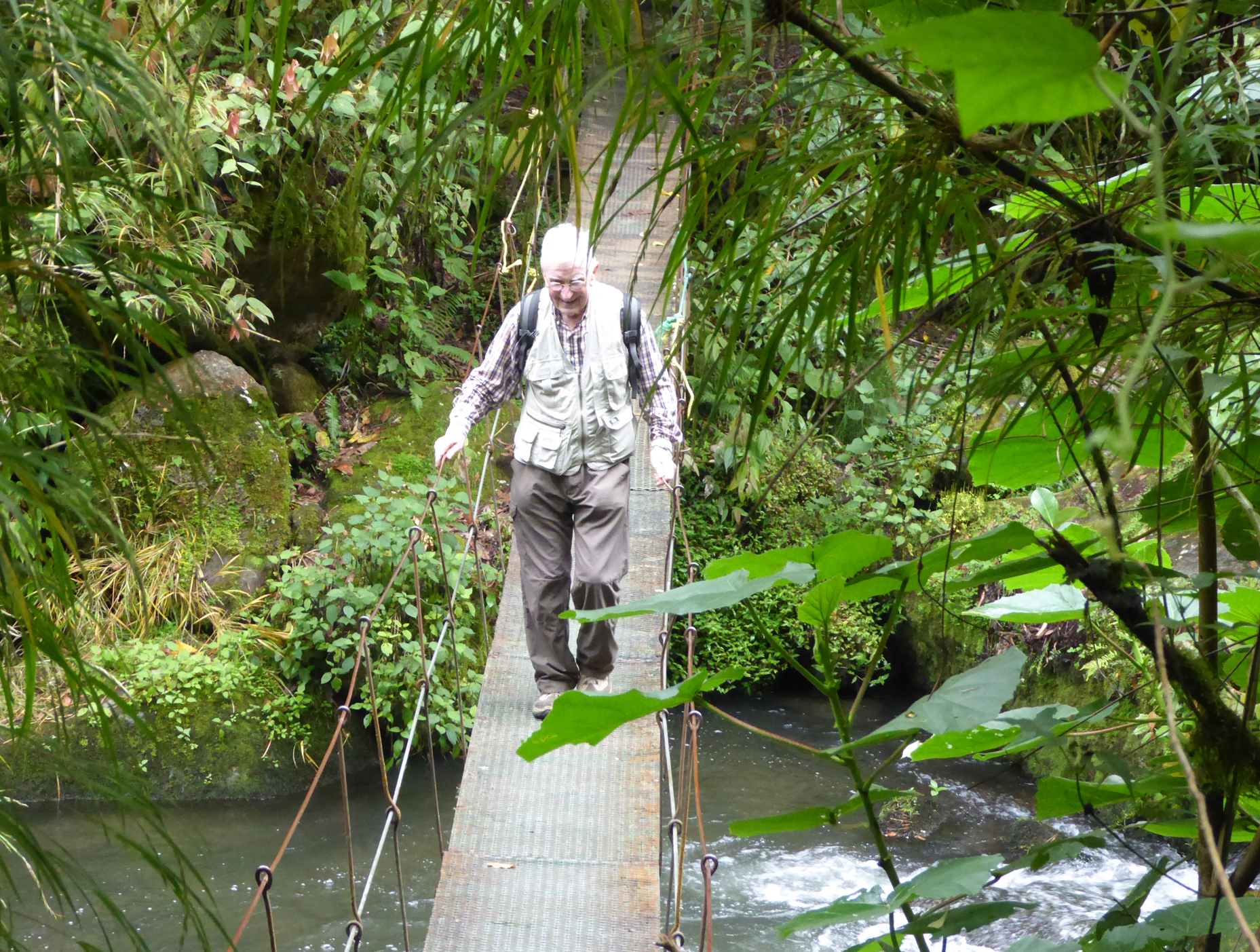 Michel crossing a suspension bridge over the Savegre River, Costa Rica