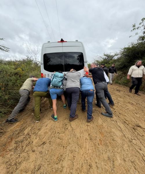 An adventurous start: Banding together to push our vans up the slick, mud-caked entrance to San Pablo Etla