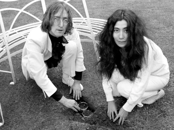 Yoko and John planting acorns